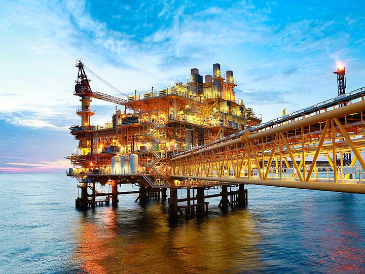 Offshore Oil Rig Offshore construction platform for production oil and gas. Oil and gas industry and hard work. Production platform and operation process by manual and auto function from control room.