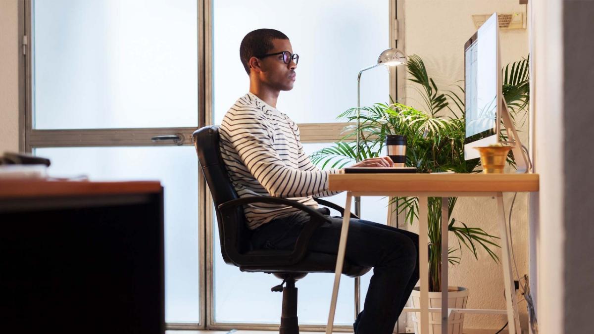SoftwareProtection_ImageBlock_ManWorkingHomeOffice Creative man working in home office
